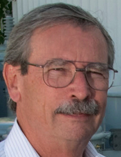 Tom Zimmerman: Man with glasses, gray hair and mustache